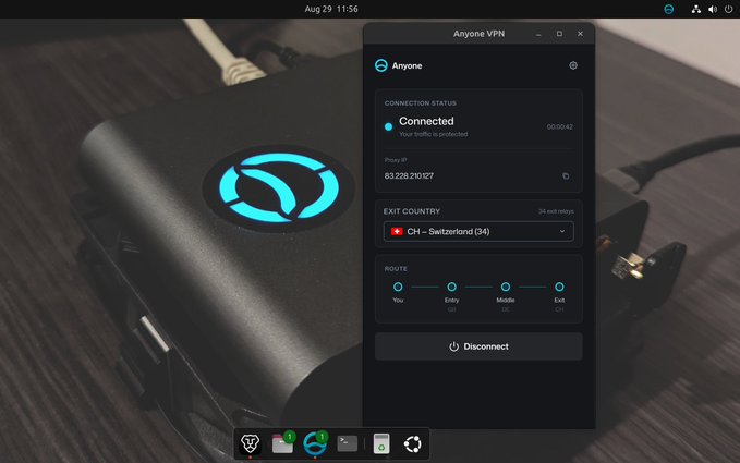 The image shows the Anyone VPN desktop app interface overlaid on a photo of a black hardware device with an illuminated "A" logo, displaying a "Connected" status with 3-hop routing through Switzerland (entry/middle/exit relays) and IP 83.228.210.207, visually reinforcing the post's claim about decentralized privacy infrastructure using multi-relay VPN connections.