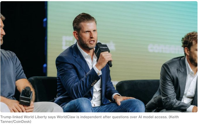 Eric Trump speaks into a CoinDesk microphone while seated on a panel, with a caption noting 'Trump-linked World Liberty says WorldClaw is independent after questions over AI model access'.