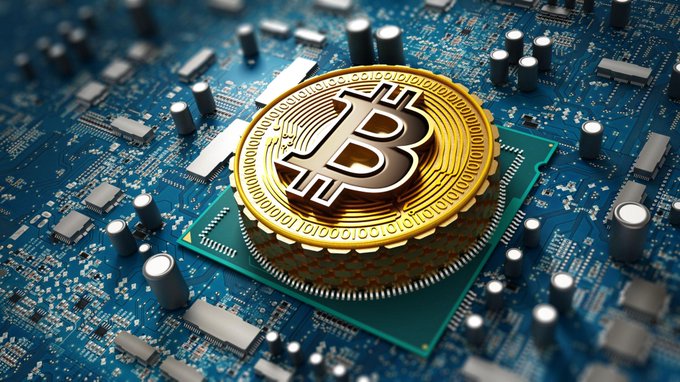 A golden Bitcoin coin sits atop a computer processor chip on a circuit board, symbolizing the cryptocurrency's resilience amid easing pressure on Asian semiconductor stocks, with BTC holding near $64.1K.
