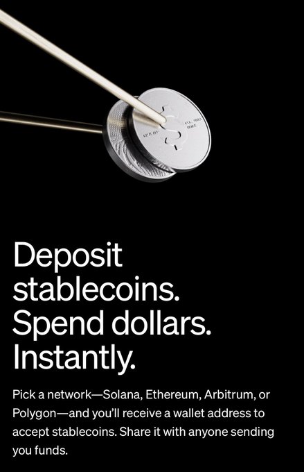 The image shows a silver coin attached to a white string with a black background. The text on the poster reads "deposit stablecoins. Spend dollars. Instantly. Pick network-Solana, Ethereum, Arbitrum, or @0xPolygon and you'll receive a wallet address to accept stablecoins. Share it with anyone sending funds."