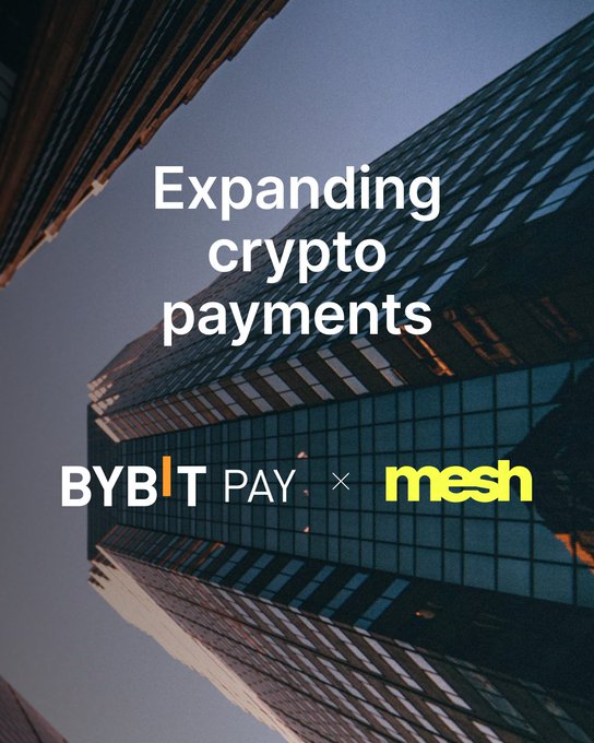 Promotional graphic announcing a partnership between Bybit Pay and Mesh to expand crypto payment options, featuring the headline "Expanding crypto payments" displayed against a dramatic upward view of modern skyscrapers at dusk.