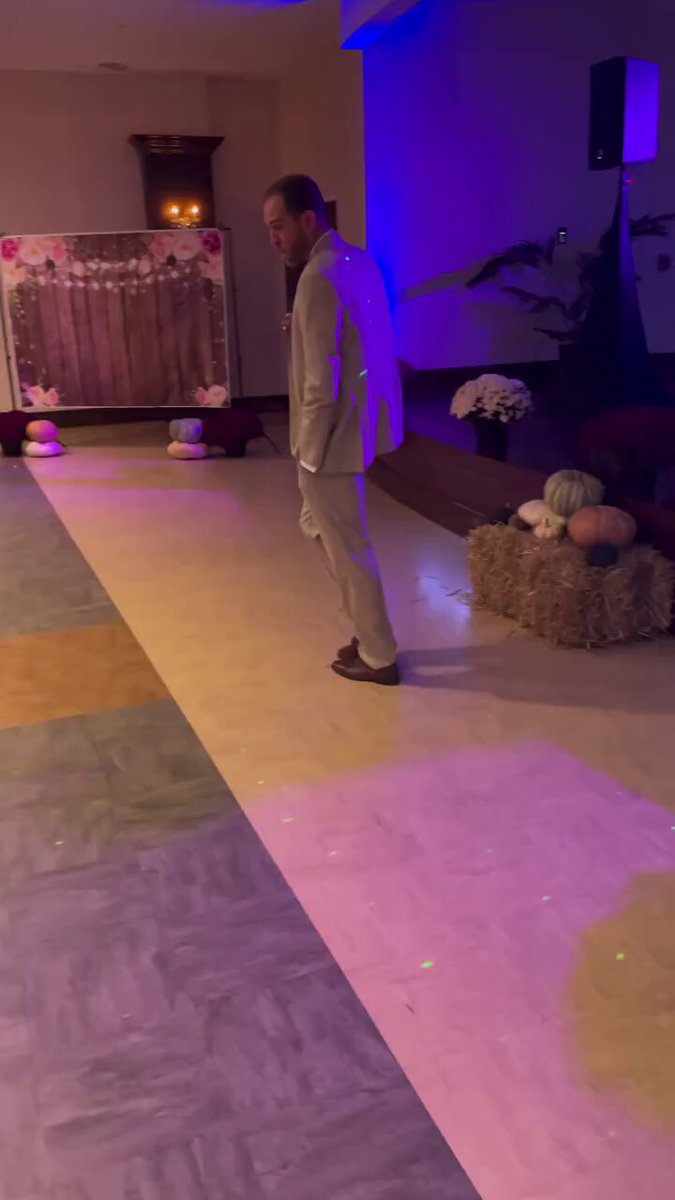 The image shows a man standing in front of a stage, possibly at an event or gathering. The stage appears to be decorated with various items such as potted plants, pumpkins, and hay bales. There are also some lights on the floor that illuminate the area around the stage. The post accompanying this image is about ERC-20s (Ethereum Cash) and how it can be used for privacy in a smart contract. It emphasizes the importance of privacy for existing assets rather than creating a separate privacy chain or asset.