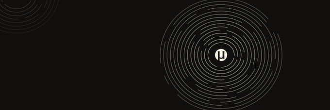 A minimalist dark graphic featuring concentric gray circular rings centered on a white caution icon with an exclamation mark, complemented by a smaller partial ring in the upper left, with the post referencing a "b-e-a-µToken" likely symbolizing a token-based alert or warning system.