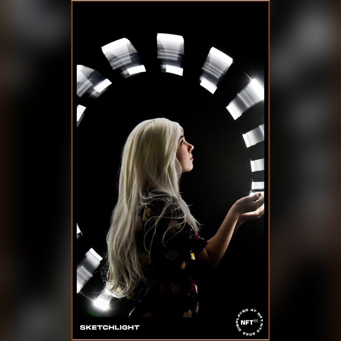 An artistic portrait of a blonde woman in profile against a black background, framed by an arc of motion-blurred lights, branded 'SKETCHLIGHT' and 'CAPTURED AT THE NFT NYC PROOF EVENT'.