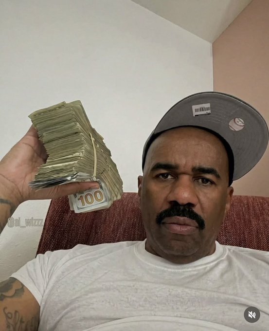 A man wearing a backwards cap and white t-shirt holding up a thick stack of $100 bills in a selfie, with the watermark '@d_wizz' visible on the image.