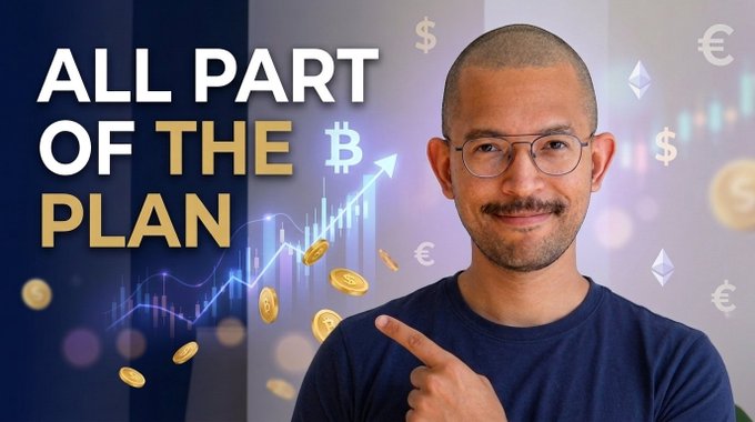A smiling man with glasses points toward bold text reading "ALL PART OF THE PLAN," set against a backdrop of Bitcoin, euro, and dollar symbols with an upward-trending price chart—visually reinforcing the video's theme that crypto wealth gains are quietly unfolding.