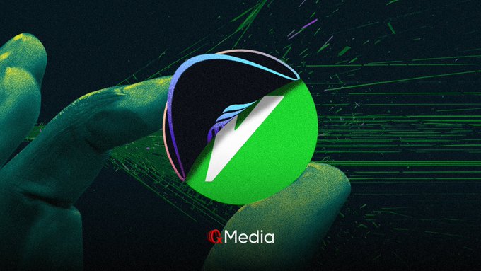 A stylized image of a hand holding a glowing green coin with a 'V' logo, credited to G.Media, against a dark background with digital streaks.