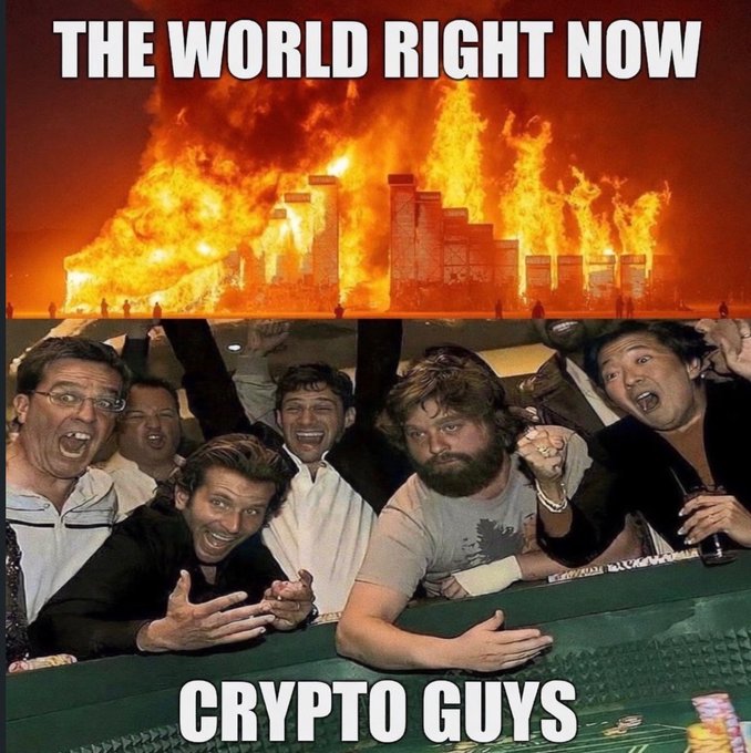 A meme captioned 'THE WORLD RIGHT NOW' showing a building engulfed in flames, contrasted with 'CRYPTO GUYS' below, depicting excited men celebrating at what appears to be a poker table.