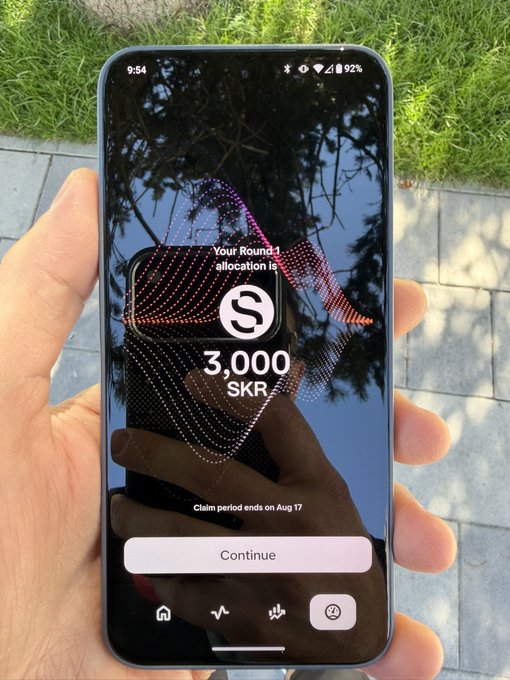 A hand holds a smartphone outdoors displaying a Seeker app screen announcing "Your Round 1 allocation is 3,000 SKR" with a claim deadline of Aug 17, visually confirming the user's post about claiming their SKR rewards from the Seeker Summer airdrop.