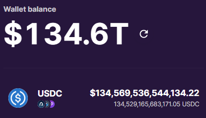 A digital wallet balance display showing "$134.6T" with USDC holdings listed as $134,569,536,544,134.22 and 134,529,165,683,171.05 USDC.