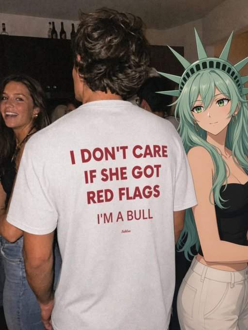 A man at a party wears a t-shirt reading "I DON'T CARE IF SHE GOT RED FLAGS I'M A BULL," with "RedFlags" signed below, while an anime-style Statue of Liberty figure stands to the right. The shirt's "bull" and "red flags" wordplay humorously mirrors the post's crypto message, suggesting bullish investors are ignoring warning signs and embracing projects without heeding fundamentals.