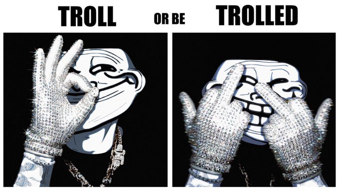The image features two black and white photos of a person wearing silver gloves, with one hand holding up their fist as if making an "ok" sign or giving a thumbs-up gesture. The other hand has its fingers spread out, creating a sense of peace and positivity. Below the images is text that reads: 
"$TROLL Or Be TROLLED."
