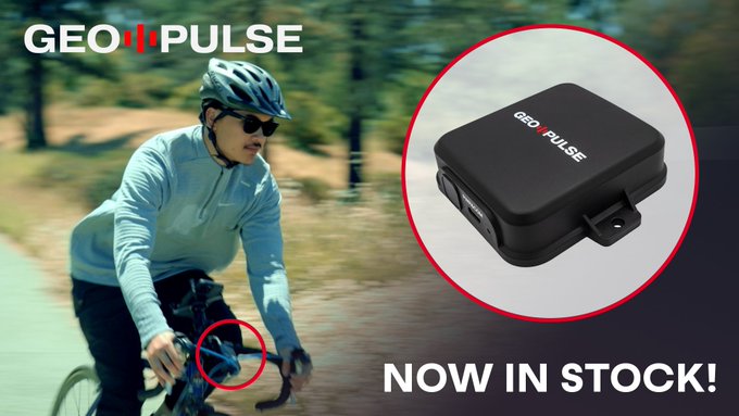 The image features a man riding a bicycle, wearing a helmet for safety. The scene takes place outdoors with trees visible in the background. There are two main elements in the image - the person riding the bike and an electronic device attached to their bicycle that reads "GEOD-PULSE". The text on the image promotes World Bicycle Day and encourages people to track their rides using the GEO-PULSE app, which can be used for centimeter-level positioning and collecting tokens.
