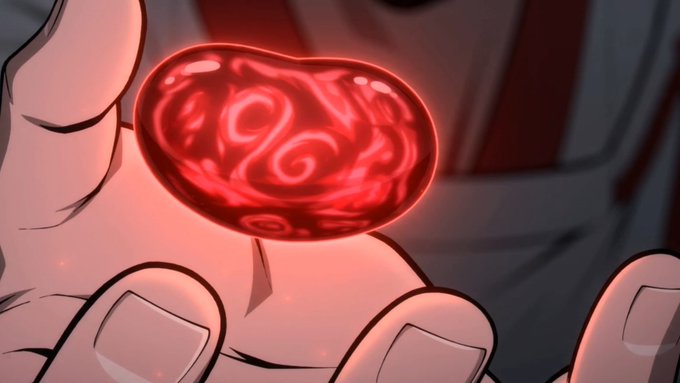 An anime-style illustration of a hand holding a glowing red orb with swirling patterns inside, casting a reddish light on the surrounding scene.