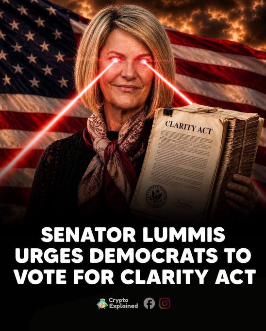 A promotional graphic from Crypto Explained showing Senator Lummis with glowing red laser eyes against an American flag background, holding the Clarity Act, with text reading 'SENATOR LUMMIS URGES DEMOCRATS TO VOTE FOR CLARITY ACT'.