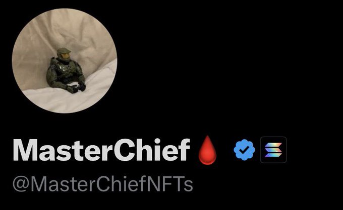 An NFT profile for 'MasterChief' with handle @MasterChiefNFTs, featuring a small Master Chief figurine in a circular profile picture and associated verification icons.