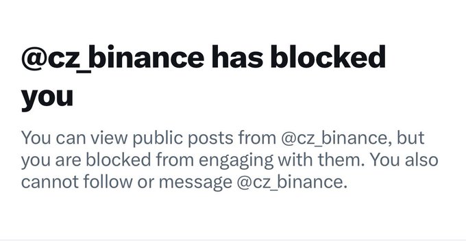 A screenshot showing a notification that '@cz_binance has blocked you' on what appears to be a social media platform.