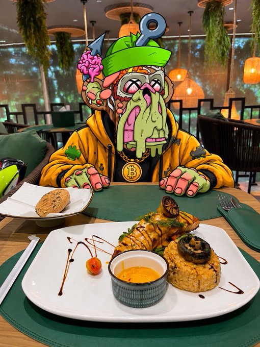 A vibrant cartoon character wearing a Bitcoin necklace and a green cap eats a plate of seafood in a restaurant setting.