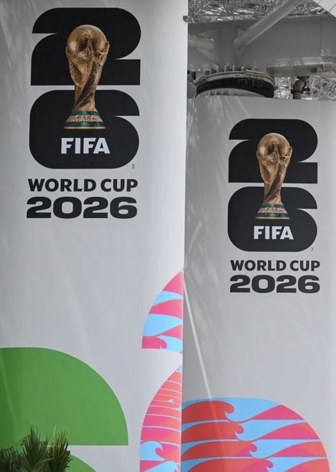 Two banners display the official logo for the FIFA World Cup 2026, featuring the golden trophy and colorful graphic elements at the bottom.