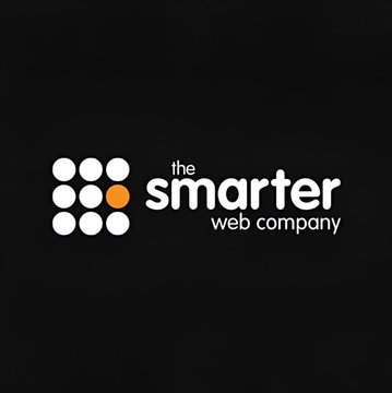 The image shows a logo for a company called "The Smarter Web Company" that has raised $400,000 through Bitcoin. The logo features a black background with white circles and an orange dot, symbolizing the company's name and their involvement in the cryptocurrency market.