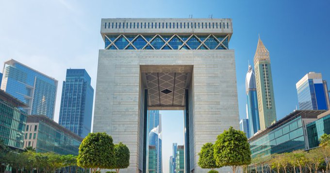 The image features a large white archway with a glass roof that spans across an urban cityscape. The archway is located at the center of the frame, surrounded by tall buildings and trees. In the background, there are skyscrapers reaching towards the sky, showcasing the impressive architecture of the city. The photo also includes text that reads "Just wrapped up one super super interesting interview with someone very special you already know that is deeply involved in getting XRP and the XRP blockchain out to as many institutions as humanly possible." This suggests that there might be a story behind this image, possibly related to the development or adoption of cryptocurrencies like Bitcoin Cash.