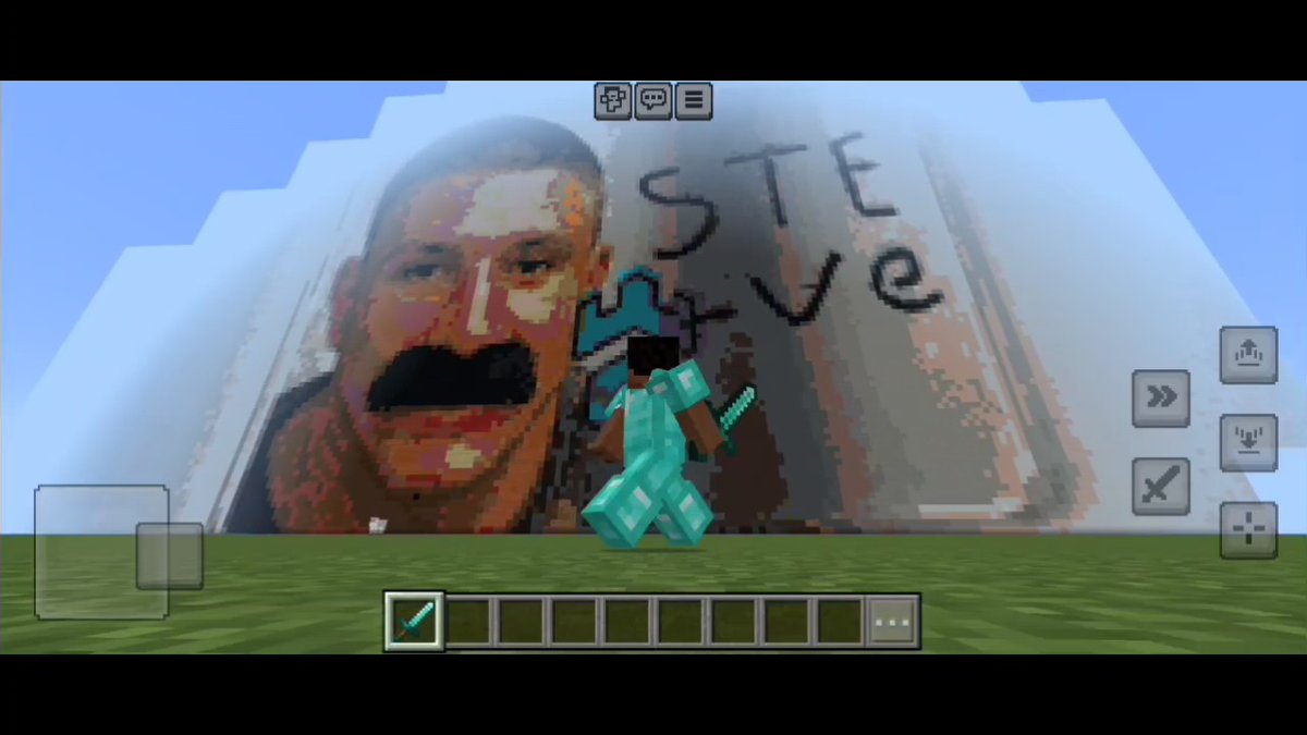 A Minecraft screenshot showing a player in diamond armor standing in front of a large pixel-art mural of a man's face with a mustache, with the handwritten text 'STEve' on the wall.