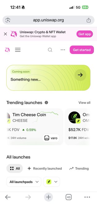 A mobile browser view of app.uniswap.org showing 'Uniswap: Crypto & NFT Wallet' with a 'Coming soon' announcement and trending launches including Tim Cheese Coin (CHEESE) and another token.
