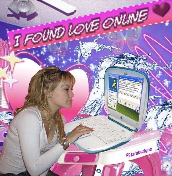 A young woman with blonde hair sits at a pink desk using a laptop, with the text "I FOUND LOVE ONLINE" displayed prominently above her in a glittery style.