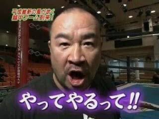 The image features a man with a mustache, wearing a black shirt, standing inside an arena or boxing ring. The caption of the image reads "#stepn #ランニング横浜マラソン、通ったっぽい" which translates to "Step on me". This phrase is written in Japanese and is accompanied by a purple background with white text, giving it an artistic touch. The man's expression suggests that he might be making a joke or expressing his frustration about the situation.