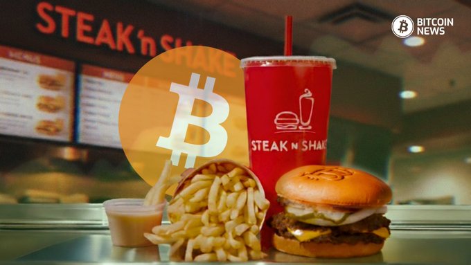 A Steak 'n Shake meal featuring a double cheeseburger, fries, sauce, and a red cup is displayed with the Bitcoin logo overlaid, visually connecting the fast-food chain's menu with its crypto payment initiative as highlighted in the accompanying Bitcoin News post.