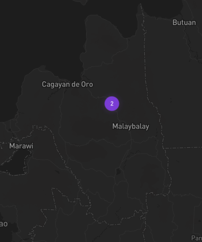 A dark map of the Bukidnon region in the Philippines shows a purple marker labeled "2" positioned near Malaybalay, with nearby cities like Cagayan de Oro, Butuan, and Marawi labeled for context. The image visually supports the post's observation about two new AirNodes appearing near Malaybalay, suggesting an expansion of World Mobile's network beyond its previously announced Siargao location.