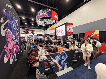 Crowds gather at the Azuki NFT/anime booth during Anime Expo, with attendees seated around gaming stations and merchandise displays featuring Azuki's signature anime artwork. The bustling convention floor is filled with fans exploring the brand's IP, consistent with the post celebrating the event's energy and excitement.