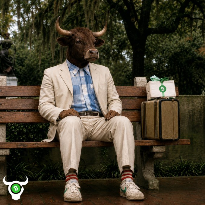 A surreal image shows a figure with a bull's head sitting on a wooden park bench, wearing a cream-colored suit jacket, blue and white checkered shirt, khaki pants, red and white striped socks, and white sneakers. Next to the bench sits a tan suitcase with a wrapped gift box on top, and a BullSwap (B) logo watermark appears in the bottom left corner.