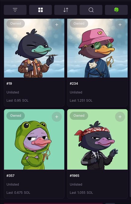 The image shows a phone screen displaying four different pictures of ducks wearing costumes, with each duck characterizing their outfit or accessories. The first duck has a green hoodie and a pink hat, while the second duck wears a brown jacket and a pink hat. The third duck is dressed in a black jacket and a pink hat, and the fourth duck sports a red bandana on its head. The screen also displays information about the ducks' owners, stating that they are listed as owned by users of the app.
