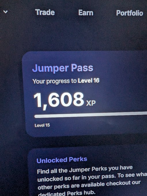 A larger view of a 'Jumper Pass' showing '1,608 XP' toward 'Level 16' from 'Level 15', with an 'Unlocked Perks' section visible below.