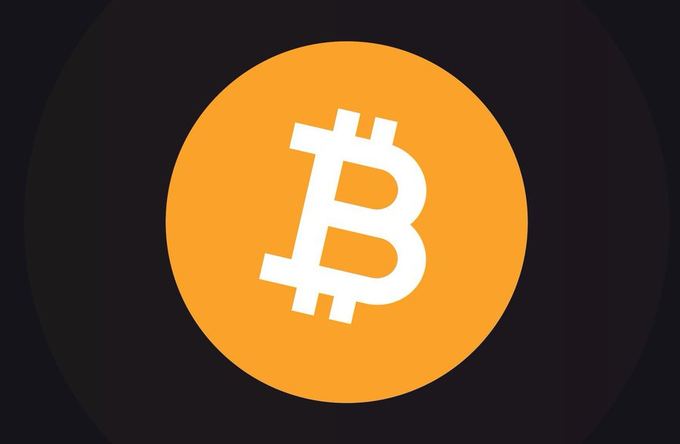 The Bitcoin (BTC) logo - a white stylized 'B' symbol with two vertical strokes on an orange circular background set against a dark backdrop.