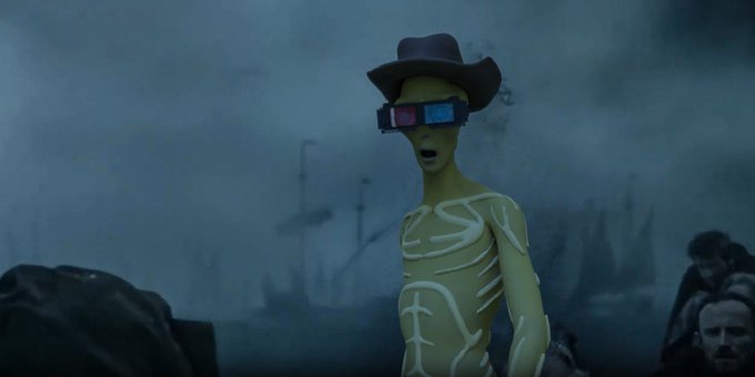 A scene shows a green-skinned character wearing a cowboy hat and 3D glasses standing in a misty, desolate landscape.