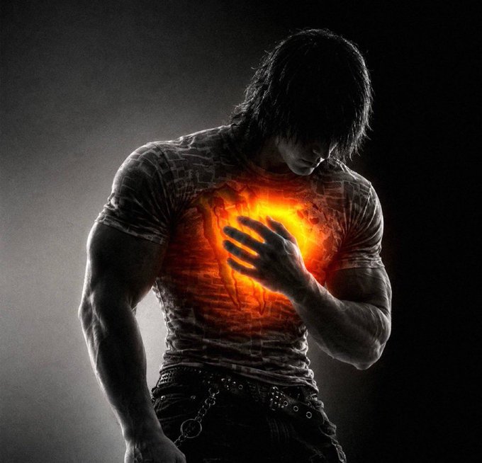 A dark, stylized image shows a muscular man with long dark hair pressing his hand against a glowing orange light radiating from his chest. The eerie luminescence breaking through his shirt visually echoes the post's caption about feeling "the runner" within his heart, suggesting a powerful, almost supernatural inner force.