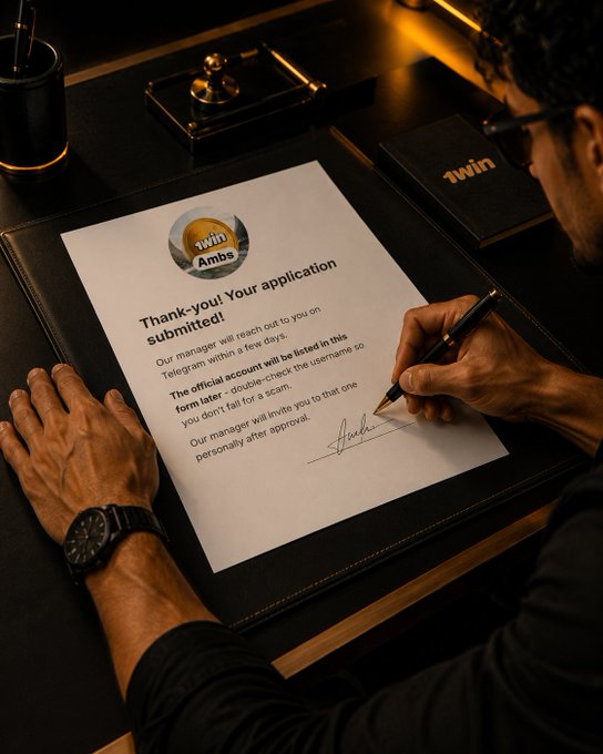 The image shows a man signing an application for the Ambassador position, which has been approved by the company. The man is sitting at a desk with a black leather chair behind him, wearing glasses that reflect light from the overhead lights. A pen is visible in his hand as he signs the application form. The post on social media encourages people to apply for the Ambassador position and mentions that the company will wait if they pick him up or if he applies again.