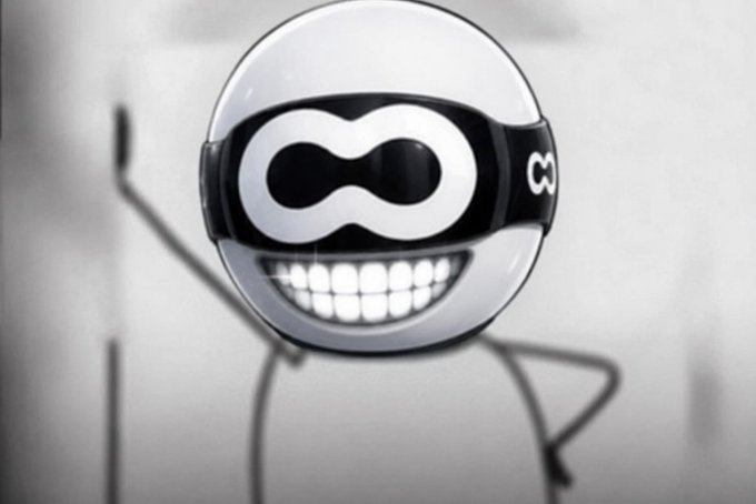 A grayscale stylized cartoon character featuring a large rounded head wearing a superhero-style mask with an infinity symbol design and the letters 'C3' on the side, displaying a wide toothy grin, with thin wireframe arms raised upward in a cheerful pose.