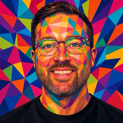 A colorful, low-poly geometric portrait of a smiling man with glasses and a beard, set against a vibrant background of multicolored triangular shapes.