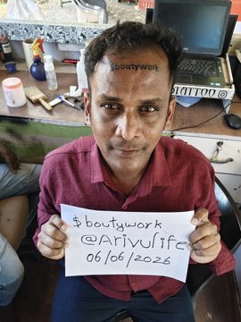 The image features a man sitting down with a paper that says "Bouttywork" written on it. The man has a tattoo of the word "N" on his forehead, which seems to be the missing letter from the post. The caption suggests that this might have been a prank or a joke by someone who found out about the missing letter and decided to create a meme using the hashtag #Bouttywork.