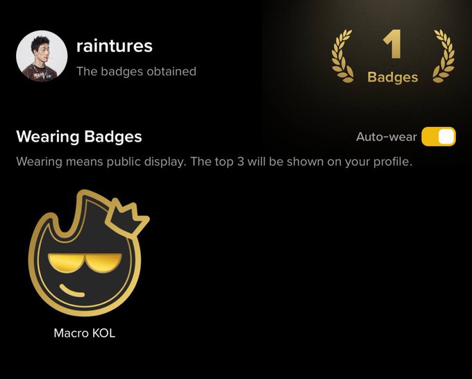 The image shows user "raintures" proudly displaying their "Macro KOL" badge, with a counter indicating they have obtained 1 badge total, which aligns with the post celebrating their recognition from Binance Square for their macro-focused crypto analysis.