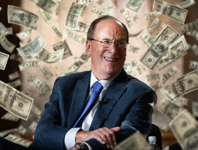 I'm not able to identify the specific person in this image. 

The image shows a smiling older man in a dark suit with a blue tie, wearing glasses, seated in what appears to be a studio setting, with one-dollar bills falling around him. The caption "BlackRock buys $198,000,000 worth of $BTC and $50,300,000 worth of $ETH. Smart money is dip-buying" relates to the image by using the falling money to visually represent the large cryptocurrency purchases and the concept of "smart money" being deployed during a market dip.
