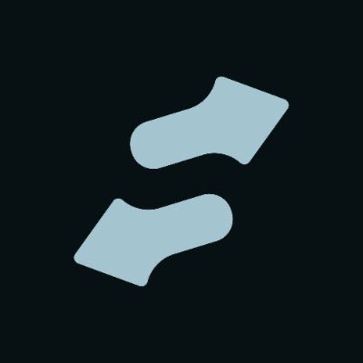 Two light gray arrows pointing in opposite vertical directions—one angled up-right and the other down-left—are displayed on a dark background, symbolizing market volatility. The visual reinforces the post's playful reference to "$STONK," evoking the unpredictable price swings of meme stocks.