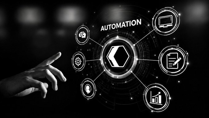A black and white graphic shows a hand reaching toward a hexagonal interface labeled 'AUTOMATION' surrounded by icons representing computers, documents, analytics, and other business functions.