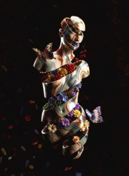 A surreal 3D digital art piece featuring a fragmented humanoid figure composed of swirled red, white, and blue colors, adorned with colorful flowers and butterflies against a dark background.