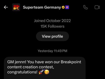 A dark-mode social media message from 'Superteam Germany' notifying a user named 'jennn!' that they have won the 'Breakpoint content creation contest'.