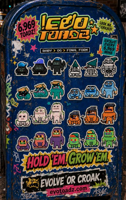 A weathered blue arcade cabinet covered in colorful pixel art stickers advertising 'LEGO TOADZ' with the tagline 'HOLD 'EM. GROW 'EM. EVOLVE OR CROAK.' and '6,969 TOADZ!'.