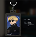 A black keychain displays a portrait of the anime character Gojo Satoru from Jujutsu Kaisen with partial English listing information.